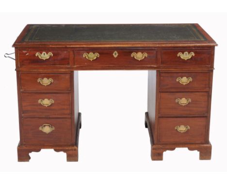 A mahogany pedestal desk in the George III style, late 19th/early 20th century  A mahogany pedestal desk in the George III st