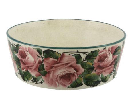 A large Wemyss circular basin, circa 1900, painted with pink roses, impressed  A large Wemyss circular basin, circa 1900,   p