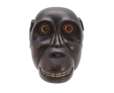 A George III mahogany novelty snuff box, circa 1800, in the form of a great ape  A George III mahogany novelty snuff box,   c