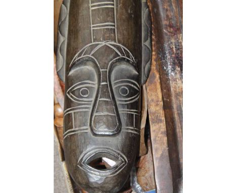 LOT OF AFRICAN AND OTHER CARVED WOODEN COLLECTABLES
including a wall-mounting African giraffe mask, tribal masks, animal figu