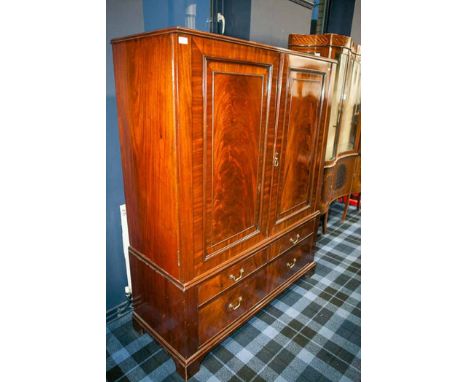 MAHOGANY PRESS CUPBOARD 
of George III design, the upper section with a partly fitted interior enclosed by two moulded panel 
