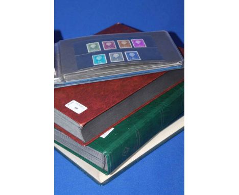 THREE ALBUMS OF WORLD STAMPS AND A FOLDER OF STAMPS AND FIRST DAY COVERS (4)