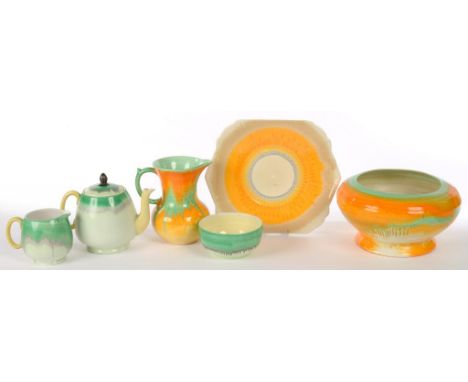 A SHELLEY EARTHENWARE TEA SERVICE, JUG, BOWL AND BONE CHINA PLATE, CIRCA 1930, WITH BRIGHTLY COLOURED STREAKED PIGMENT DECORA