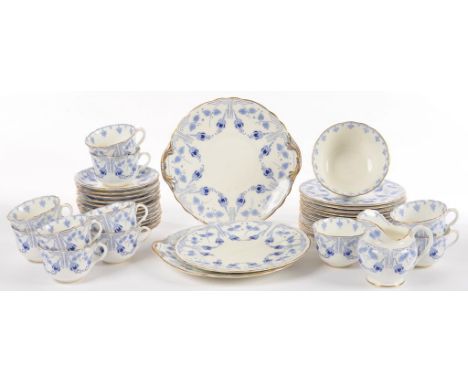 A ROYAL DOULTON ART NOUVEAU BLUE AND WHITE BONE CHINA FUSCHIA PATTERN TEA SERVICE, C1903, PRINTED MARK AND FUSCHIA RD NO 4061
