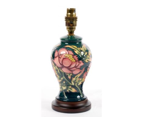 A MOORCROFT LAMP DECORATED WITH PINK FLOWERS ON A GREEN GROUND, 19CM H EXCLUDING FITMENT ++GOOD CONDITION