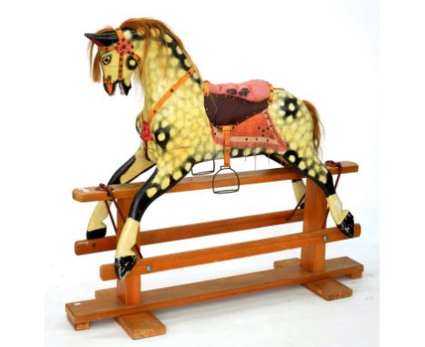 A PAINTED WOOD ROCKING HORSE, PROBABLY LINES BROTHERS, ON LIGHT WOOD STAND, 123CM H, CIRCA MID 20TH C