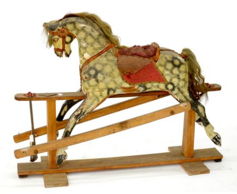 A PAINTED WOOD ROCKING HORSE, PROBABLY LINES BROTHERS, ON LIGHT WOOD STAND, 125CM L, SECOND QUARTER 20TH C