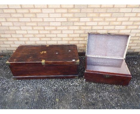 A large trunk with brass bound corners, approximately 37 cm x 110 cm x 52 cm and one other.