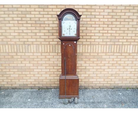 A late 18th/ early 19th century 8-day longcase clock, oak case with full length trunk door having arched top and inlaid conch