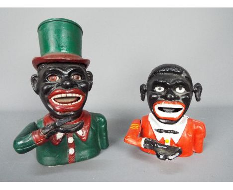 Two cast iron, mechanical money banks, largest approximately 21 cm (h). [2]Note: Mechanical cast iron banks were first manufa