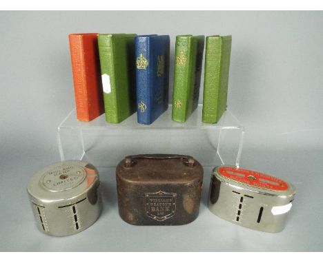 Eight vintage savings money banks comprising a Williams Deacon's Bank Ltd  money box with handle, a Cheltenham &amp; Gloucest
