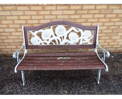A cast iron and wood slat garden bench with sunflower design to the backrest, approximately 127 cm (l)