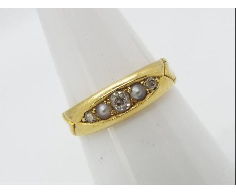 A late Victorian 18ct gold ring set with diamonds and seed pearls, size N, approximately 3.2 grams all in.