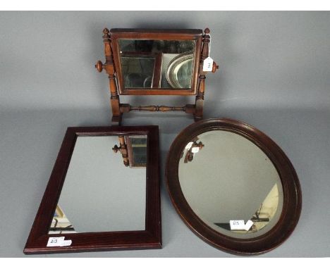 A mahogany framed toilet mirror and two wall mirrors. [3]