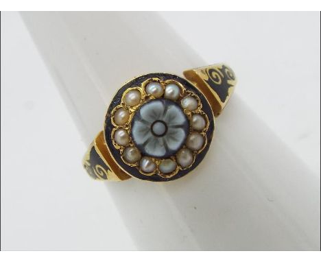 A 15ct gold ring set with seed pearls and black enamel, size N½, approximately 2.6 grams all in.