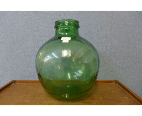 A small vintage green glass carboy 