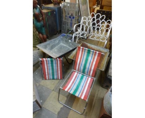 Two vintage wheelbarrows and three folding deckchairs 