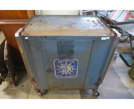 A vintage industrial Sun Service Equipment metal cabinet 