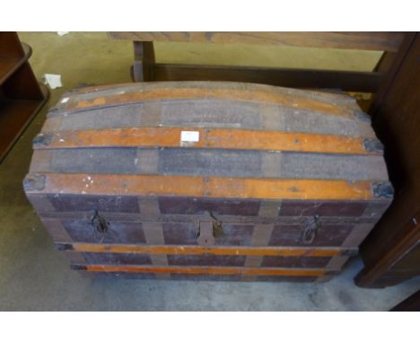 A dome topped steamer trunk 