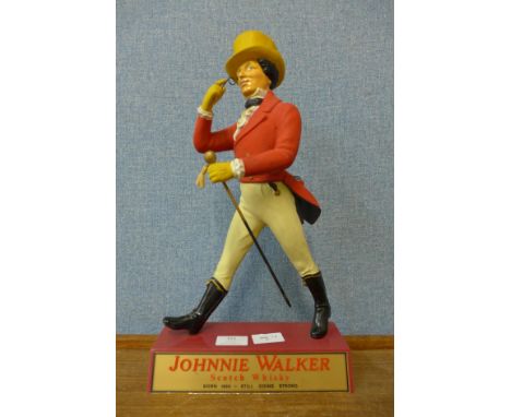 A Johnnie Walker Scotch Whisky advertising sign 