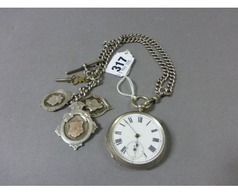 Silver Cased Pocket Watch, the white enamel face with seconds aperture together with a Silver Curb Link Fob Chain and Three '