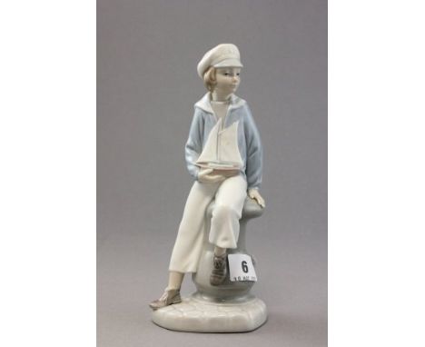 Lladro Figure of a Boy holding a Toy Boat