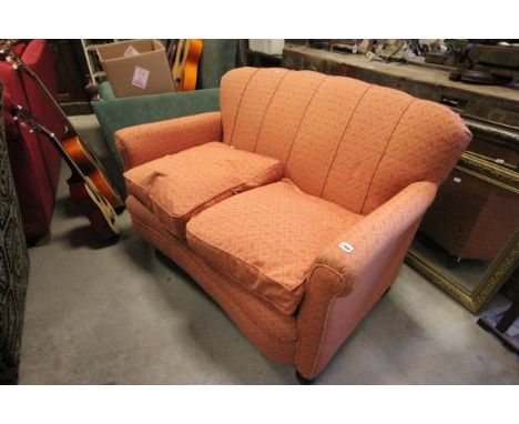 Edwardian Two Seater Upholstered Sofa on mahogany bun feet and castors