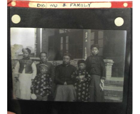 CHINA, PHOTOGRAPHY.  Group of 37 glass lantern slides, circa 1920s, in red cloth box.