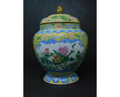 A Chinese enamel jar and cover, decorated with vignettes of birds and flowers within a yellow ground with scrolling foliage, 