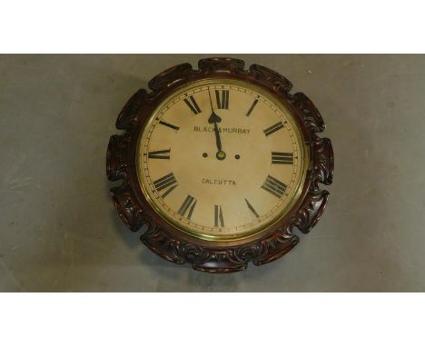 A 19th century carved mahogany cased wall clock, Black and Murray Calcutta H.43 W.43 D.18 