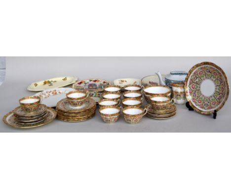 A late 19th century tea service from Court China, comprising saucers, side plates, dinner plates, tea cups and cream jug (32)