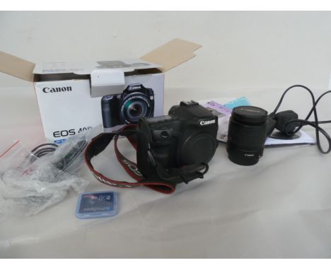 A Canon EOS 40D boxed digital SLR camera with strap instruction manual charger and 2gb memory card with Canon zoom lens ef 28