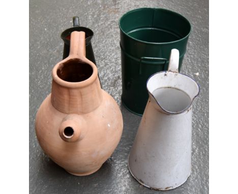 A vintage white enamel jug with one other together with a metal planter and a clay jug
