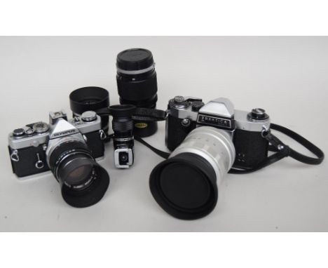 A Praktica PL nova 1 camera with a Hanimex 300mm F 6:3 lens, an Olympus OM-1 with an Auto-T 1:2.8 f=100mm lens, together with