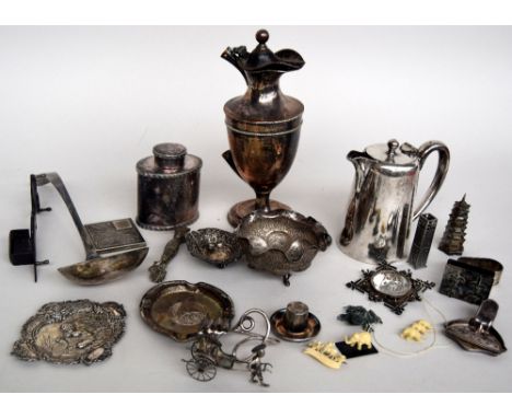 A selection of various white metal and EPNS items to include a claret jug (af), a talcum bottle, an ashtray with Mexican coin