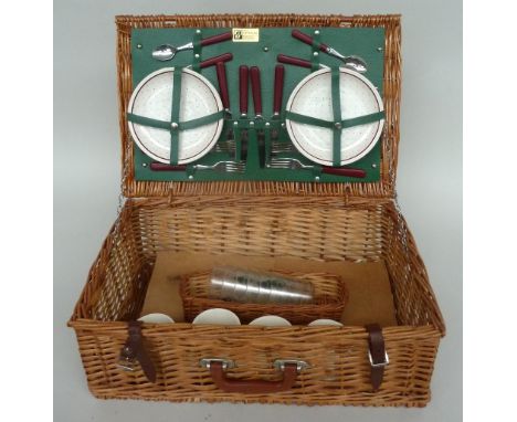 An Optima wicker picnic hamper with flatware and plates for four, together with six Game Conservancy plastic beakers