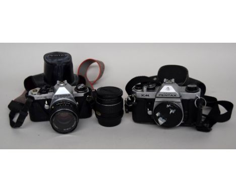 An SMC Pentax 1:3.5 lens, a Pentax ME Super 35mm camera with an SMC Pentax 1:18 lens, a Pentax Asahi KM 35mm camera body toge