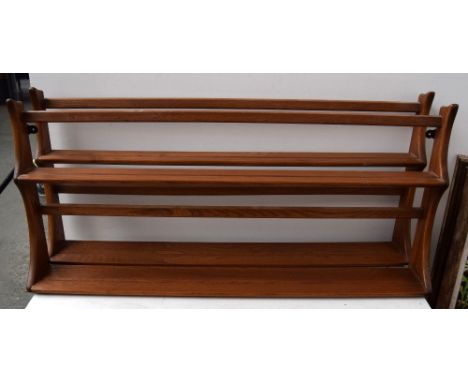 A matching pair of Ercol hanging plate racks, 46cmL, 96cmH