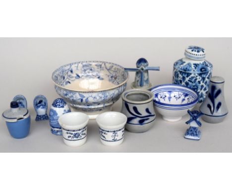 A selection of blue and white pottery including a salt shaker, a ceramic windmill and a scent bottle, amongst others