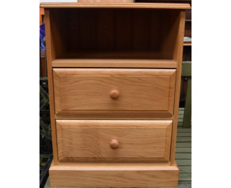 A modern oak side table with one shelf over two drawers, 46 x 52 x 74cmH