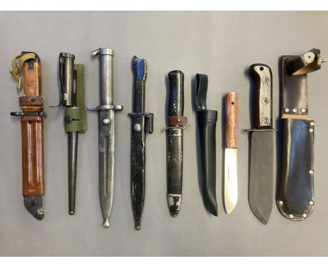 * Knives. A military survival knife, the wide burnished steel blade stamped 127/8214 JR 1983 with war department arrow, steel