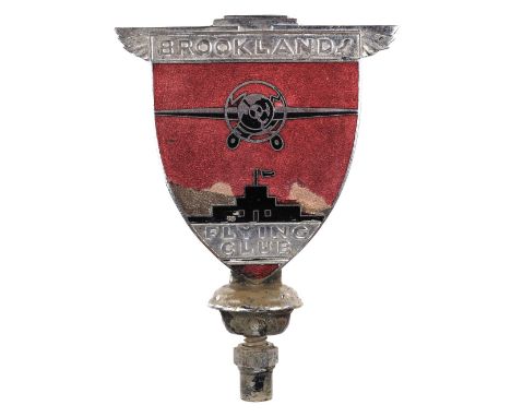 * Brooklands Flying Club. An art deco members car badge, circa 1920s, chrome with red and black enamels depicting a monoplane
