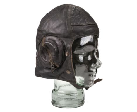 * Flying Helmet. WWII RAF Battle of Britain period B Type flying helmet, circa 1940, dark brown leather with zip-up ear cups 