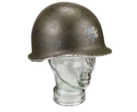 * WWII American M1 steel helmet of the 29th Infantry Division, circa 1944, green painted finish to the shell with blue and gr