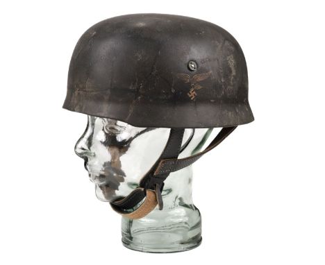 * German Helmet. WWII German Paratroopers (Fallschirmjäger) reproduction steel helmet, the steel shell finished in camouflage