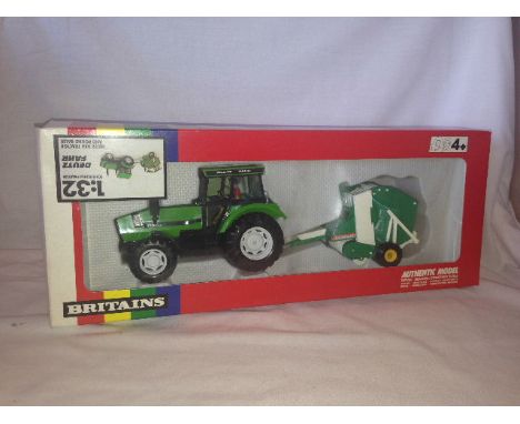 BRITAINS - DEUTZ DX6 TRACTOR AND ROUND BALER - (9628)