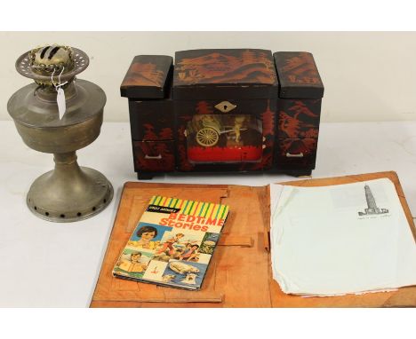 Japanese musical cabinet, together with an oil lamp, an Uncle Arthurs Bedtime Stories book and a leather plotter (4)