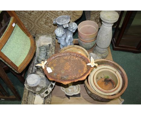Collection of garden planters, ornaments, and birdbaths, various shapes and sizes, largest planter 90cm long (qty)