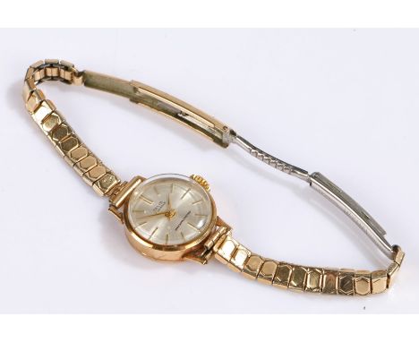 Tallis 9 carat gold ladies wristwatch, the signed silver dial with baton markers, manual wound, on a rolled gold bracelet, ma