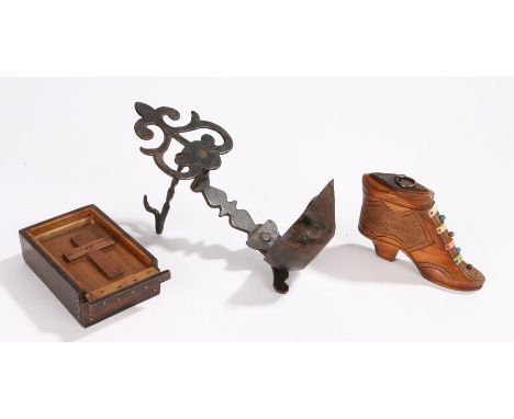 Carved wooden snuff shoe with bead decoration, steel hanging oil lamp, with scroll pierced back plate above a reservoir with 